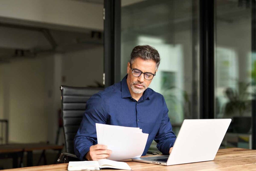 Man working at his laptop during tax time.